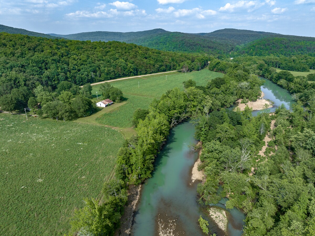 Cass House in the trees — 100 yards from the Mulberry River