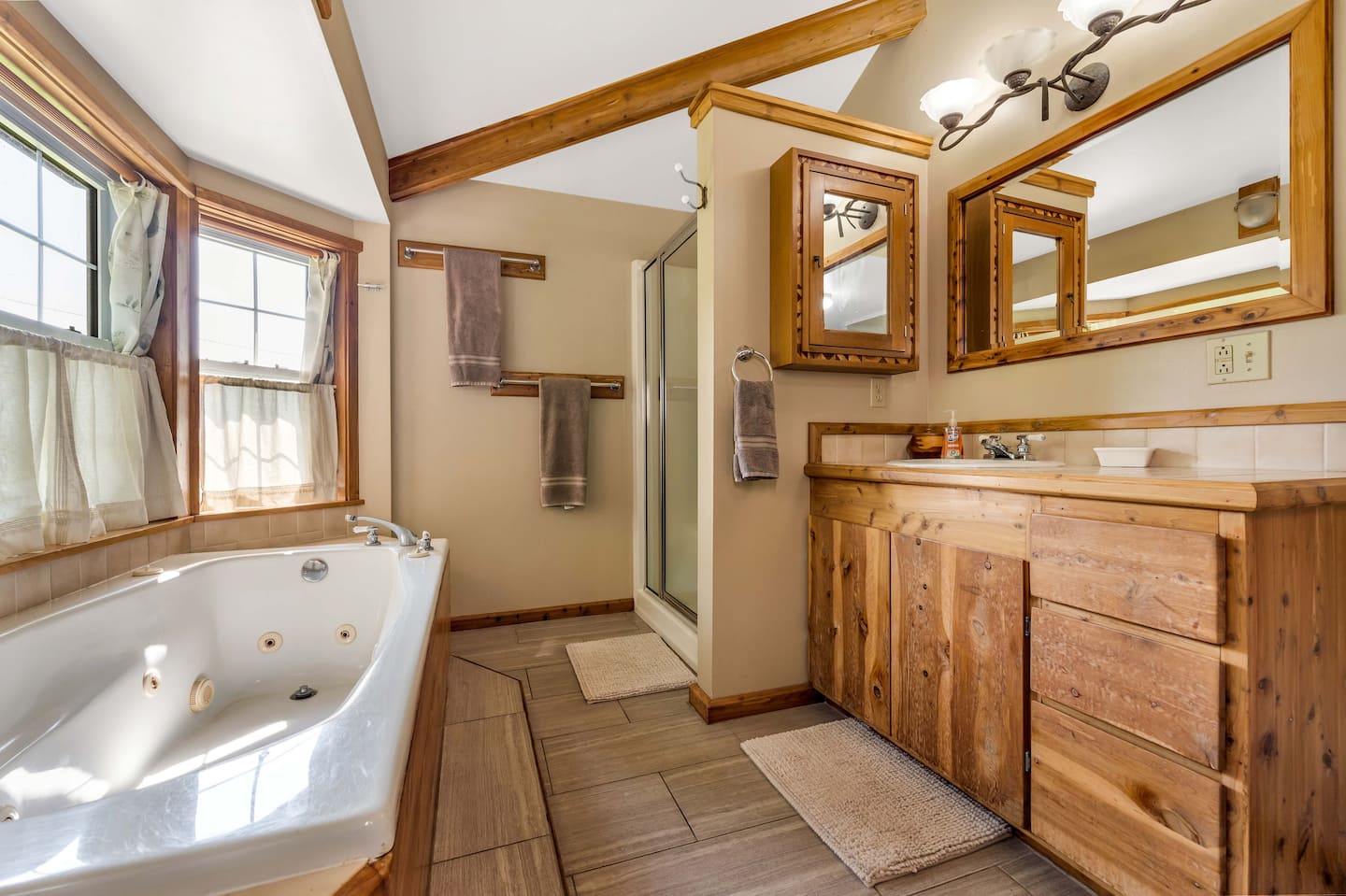 Cass House living room with gas fireplace, desk, and TV
