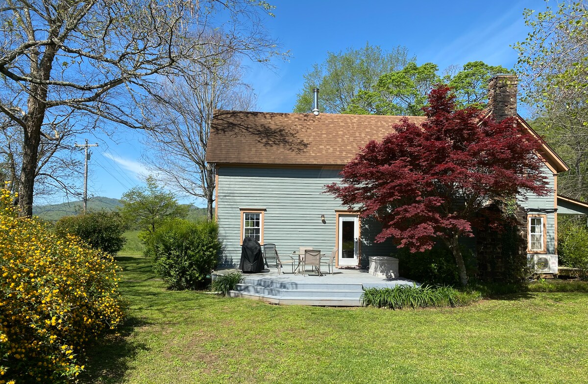 Cass House side yard in spring — 10 acres of lush Ozark landscape